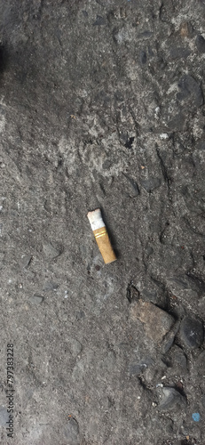 Cigarette butts on the asphalt