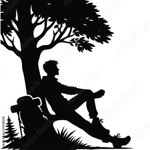 silhouette of a hiker resting against a tree along the trail