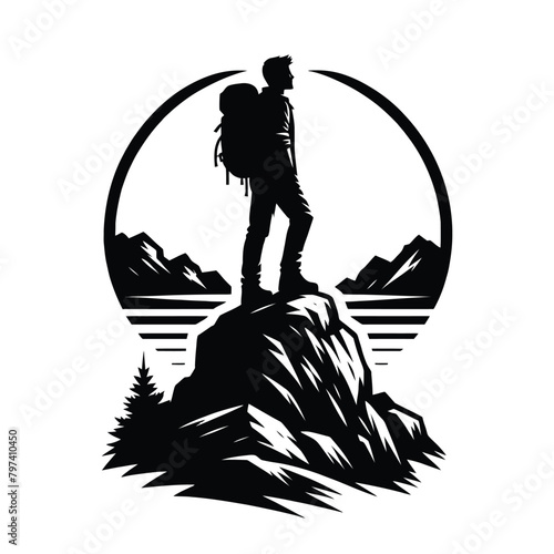 silhouette of a hiker standing on a rocky outcrop
