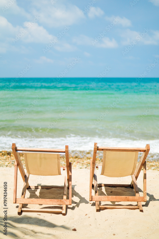 Seaside picnic chairs on an island with white beaches and bright blue waters for vacationers looking to relax. Seaside picnic chairs on an island with white beaches and bright blue waters for vacationers looking to relax.