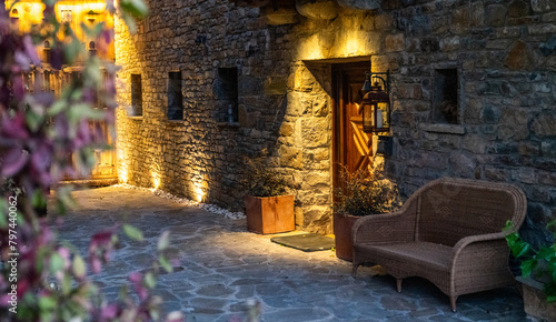 The scenic architecture of spanish village in mountain in Pyrenees mountains, Huesca, Aragon, Spain. Village of Anso, one of the most beautiful villages in Spain at the sunset. photo