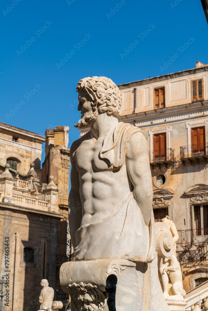 Palermo, Sicily, Italy. Pretoria Fountain - A 16th-century fountain known for its grand composition of a series of pools and statues of mythological characters. Sunny summer day