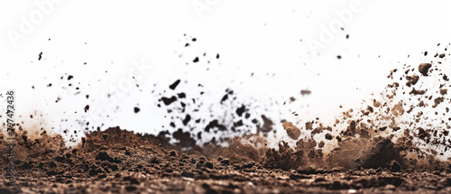 Dirt and soil particles billow up into the air on white background.