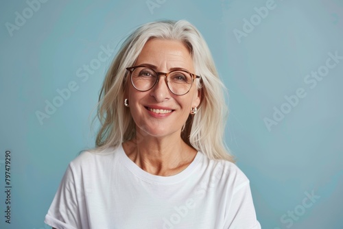 Smiling middle aged woman white t-shirt mockup template for logo or text advertisement photo
