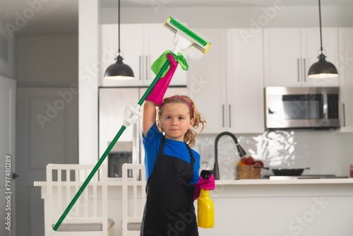 Housekeeping, home chores. Portrait of child helping with housework, cleaning the house. Housekeeping, home chores.