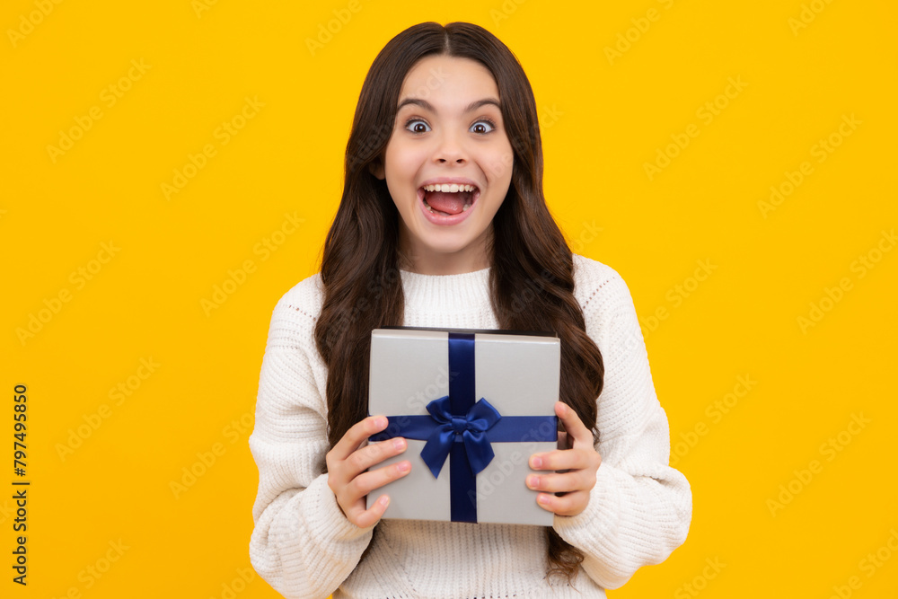 Excited teenager girl. Cute teenager child girl congratulate with valentines day, giving romantic gift box. Present, greeting and gifting concept. Birthday holiday concept.