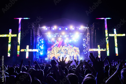 Canvastavla Outdoor religious music festival at night with vibrant stage lights