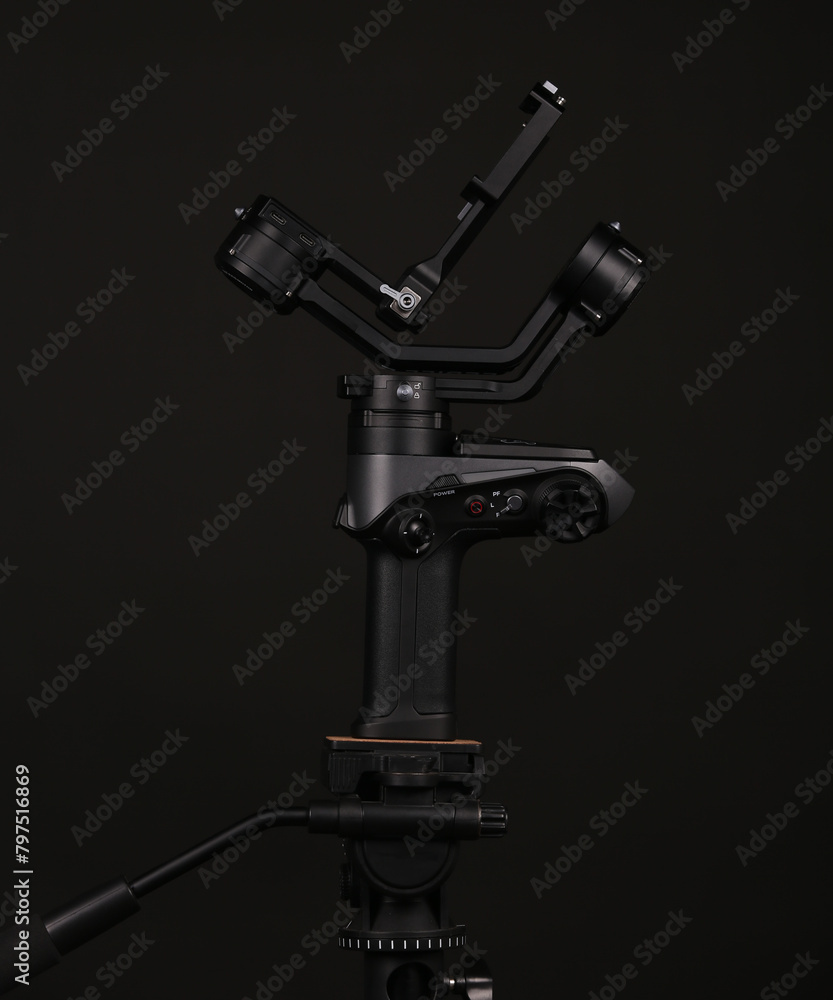 Black gimbal photography captures the art of smooth and stable shots using a sleek black gimbal device. 