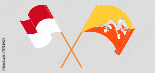 Crossed and waving flags of Monaco and Bhutan