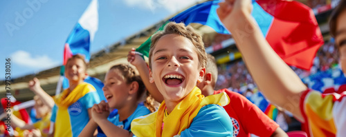 Group of happy children watching together a sports event in the stadium  © Pixelmagic