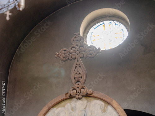 Фотография Ornate wooden cross on the top of the iconostasis in  a Bulgarian Orthodox Christian church