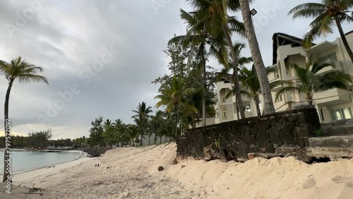 The deserted beach on the island of Mauritius on the beach of a hotel complex at sunrise. The beautiful and untouched nature
