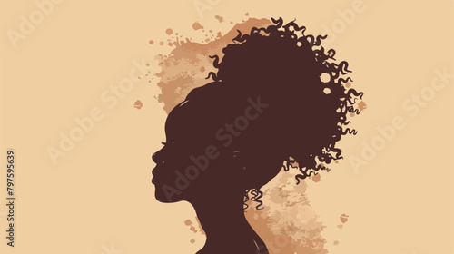 Silhouette of Black woman with curly hair in a bun. photo