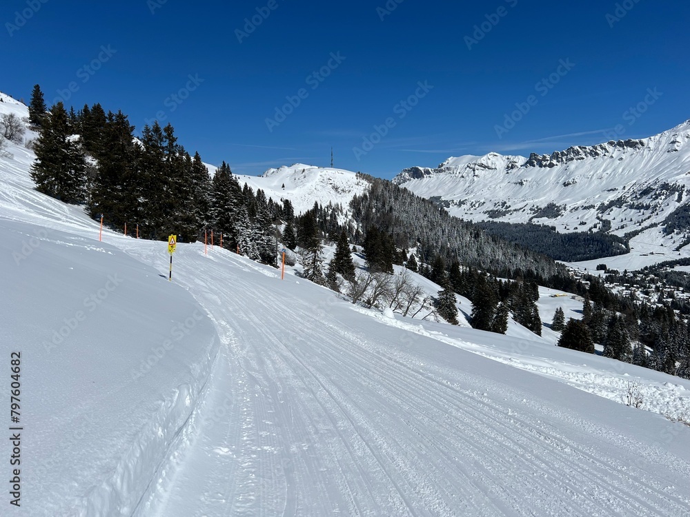 Amazing sport-recreational snowy winter tracks for skiing and snowboarding in the area of the tourist resorts of Valbella and Lenzerheide in the Swiss Alps - Canton of Grisons, Switzerland (Schweiz)