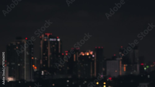 Blurred of night city skyscraper and tower lights bokeh , Soft Focus , Metropolis Backgound wallpaper for movie or documentary romantic mood concept	
