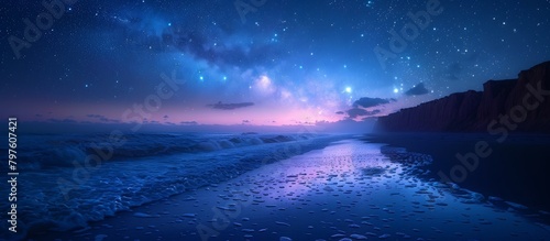 The coastline stretches out, kissed by the evening tide, as stars begin to emerge in the velvety night sky.  photo