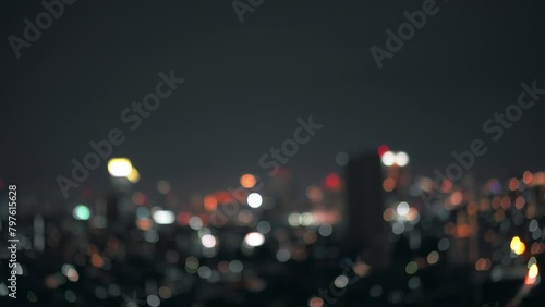 Blurred of night city skyscraper and tower lights bokeh , Soft Focus , Metropolis Backgound wallpaper for movie or documentary romantic mood concept	
 photo