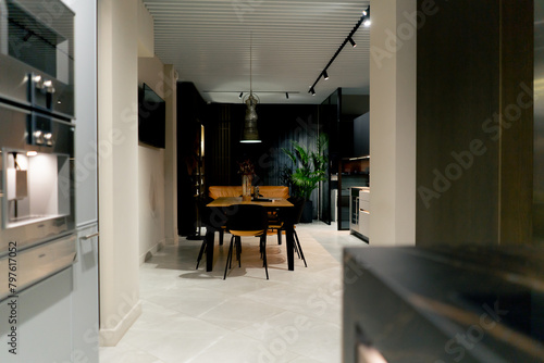 homely atmosphere of a designer apartment with a kitchen leading into living room minimalism in design © Guys Who Shoot