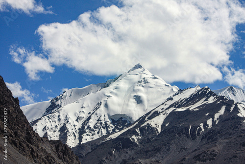 A stunning view of Snow covered mountains and clouds near Khunjerab Pass  Hunza Nagar