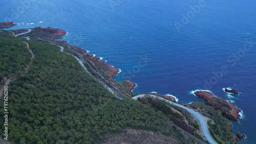 Aerial view of the Massif de L'Esterel and a beautiful winding road over the cliffs falling into the Mediterranean Sea. French Riviera. Cote d'Azur photo