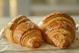 French Morning Delights: Soft Focus Photography of Two Delicious Croissants from a Fresh Bakery