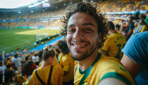 Selfie of spectator in the stadium celebrating with his team and the green and yellow colors. Brazil fans.  Man