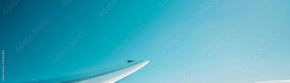 Closeup advertising image of a wind turbine blade against a crystalclear blue sky, highlighting the majestic scale and clean energy theme