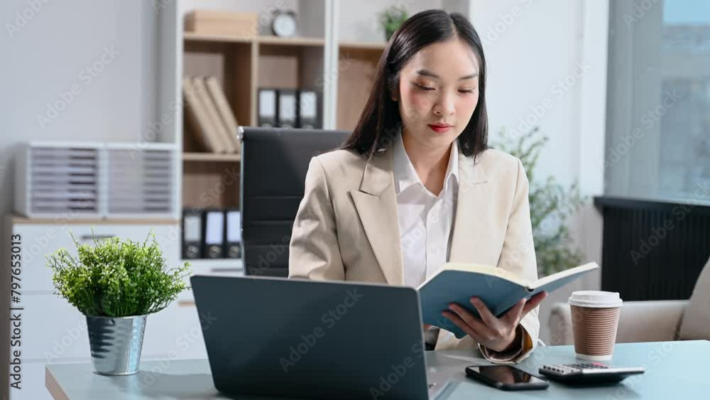 Successful Asian Businesswoman Analyzing Finance on Tablet and Laptop at modern Office Desk tax, report, accounting in office Successful Asian Businesswoman Analyzing Finance on Tablet and Laptop at modern Office Desk tax, report, accounting in office