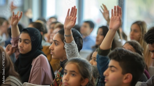 International Youth Day: engaged students raising hands in a classroom. International Youth Day