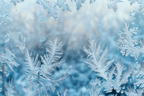 The textured surface of a frost-covered windowpane features intricate frost patterns and icy formations. Frosty window textures offer a chilly and wintery backdrop