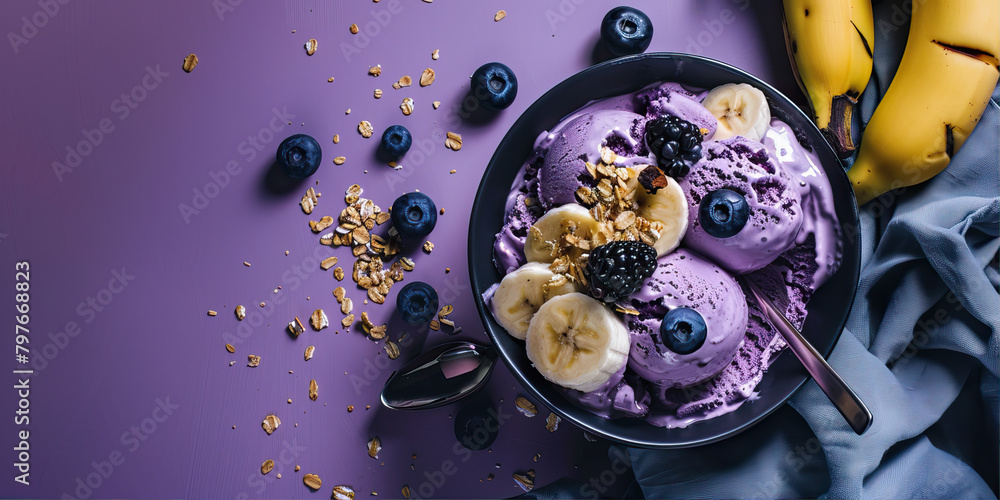 Bowl with ice cream, banana and blueberries on the table
