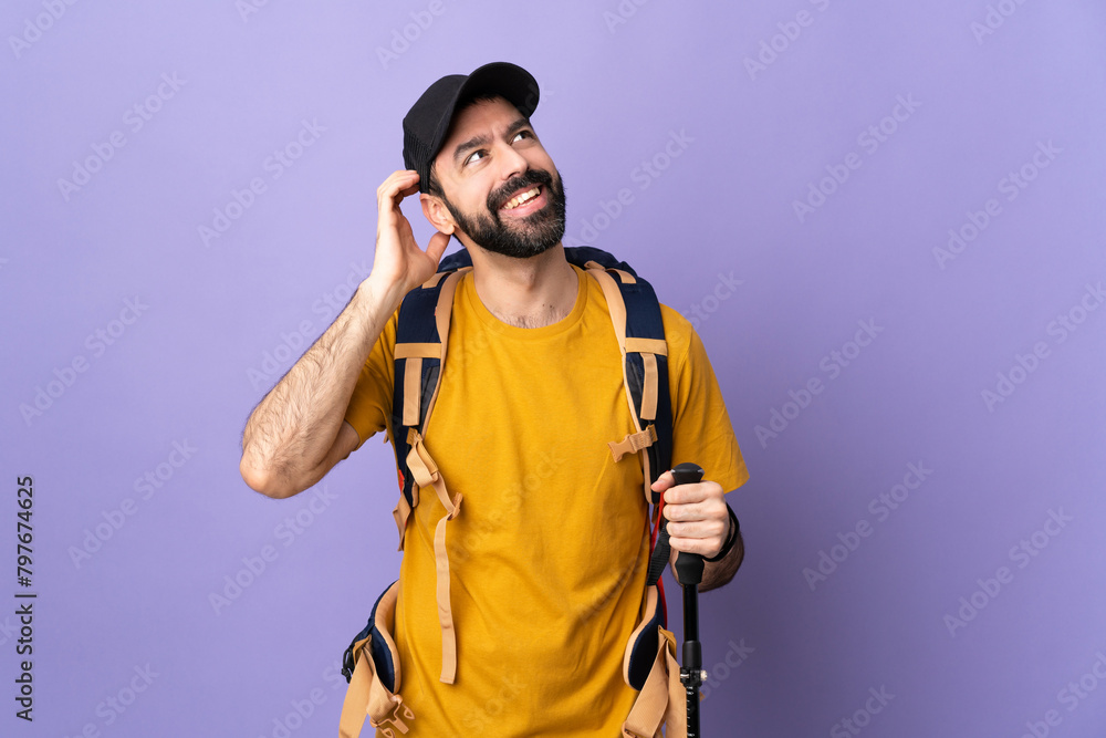 Caucasian handsome man with backpack and trekking poles over isolated background thinking an idea Caucasian handsome man with backpack and trekking poles over isolated background thinking an idea