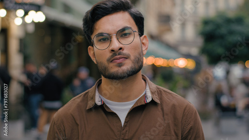 Canvas Print Close up portrait dissatisfied serious Indian Arabian ethnic male man student bu