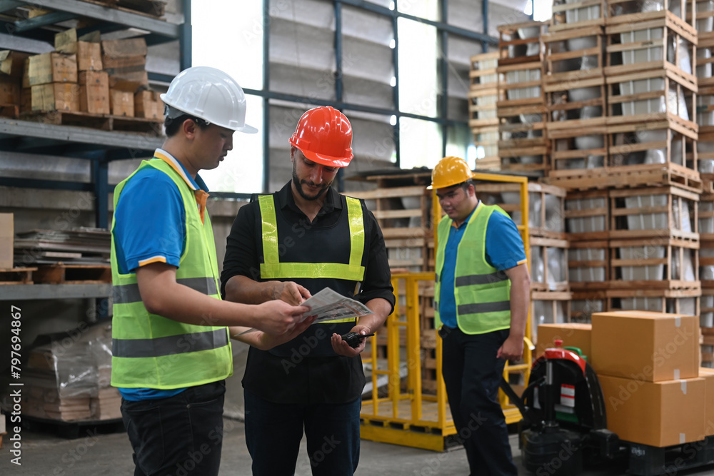 The Caucasian warehouse manager leader assignment a new employee, job, training for worker, and meeting before work The Caucasian warehouse manager leader assignment a new employee, job, training for worker, and meeting before work