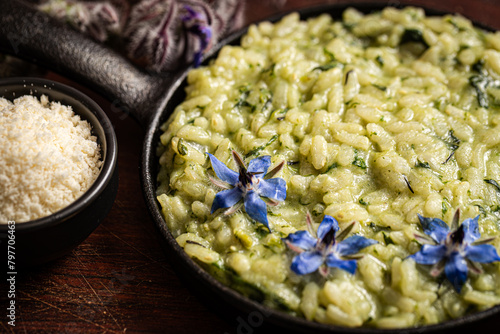Indulgent risotto elevated by fragrant borage leaves.