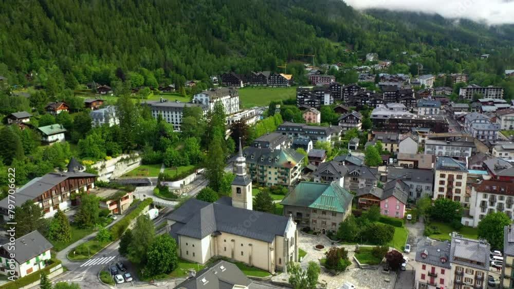 Aerial view circling the Church of Chamonix and over the town, in sunny France Aerial view circling the Church of Chamonix and over the town, in sunny France