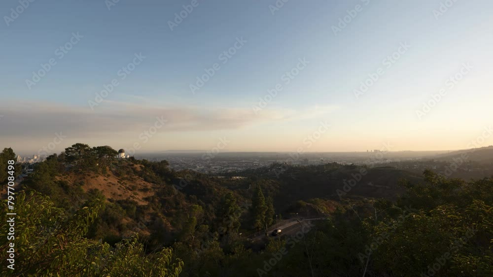 A sunset turns into a moonlit night timelapse over the city of Los Angeles as viewed from the nearby hills. A sunset turns into a moonlit night timelapse over the city of Los Angeles as viewed from the nearby hills.