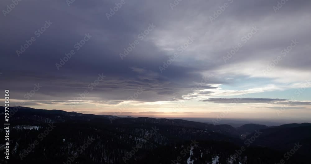 A dramatic sunset with beautiful clouds over the mountains near Cloudcroft, New Mexico, aerial view A dramatic sunset with beautiful clouds over the mountains near Cloudcroft, New Mexico, aerial view