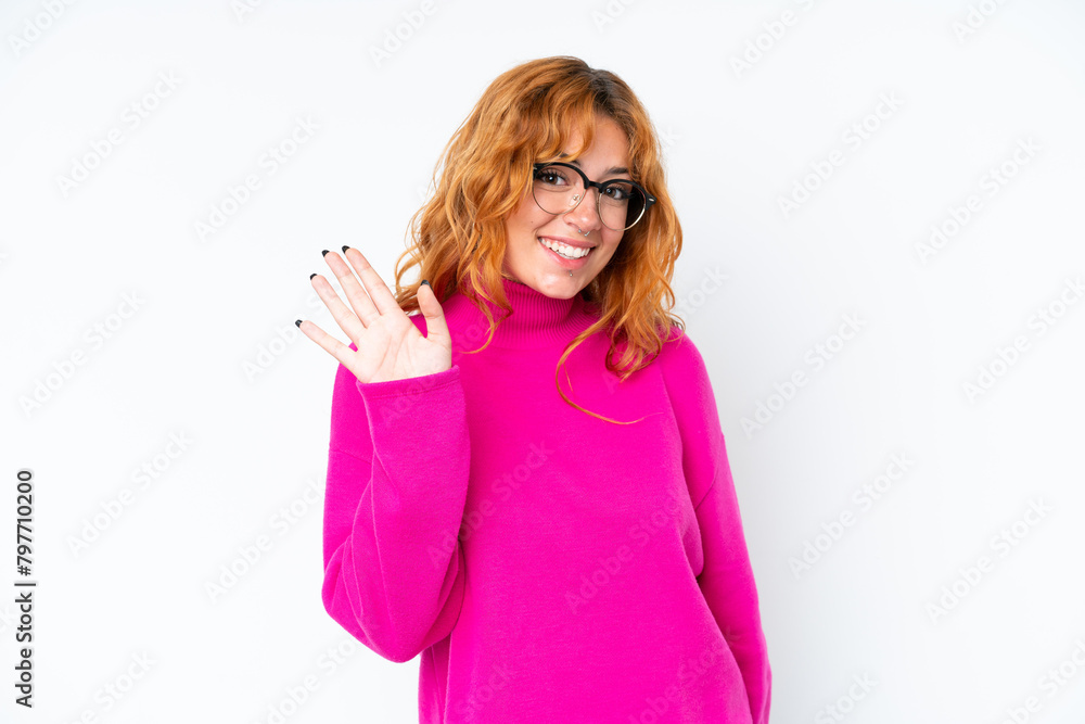 Young caucasian woman isolated on white background saluting with hand with happy expression Young caucasian woman isolated on white background saluting with hand with happy expression