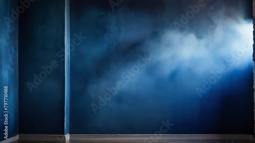 Decorative stucco on a dark blue wall with a smoky background. spotlight, haze, and smoke. photo