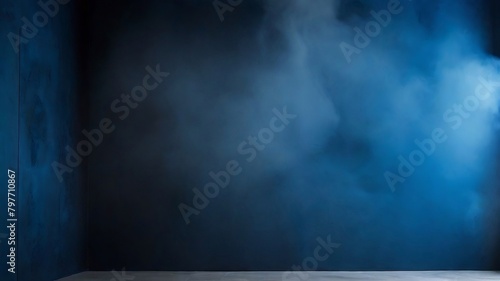 Decorative stucco on a dark blue wall with a smoky background. spotlight  haze  and smoke.