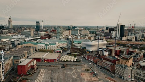 A wide drone shot pulling back from the city centre skyline in Birmingham, England, UK. photo