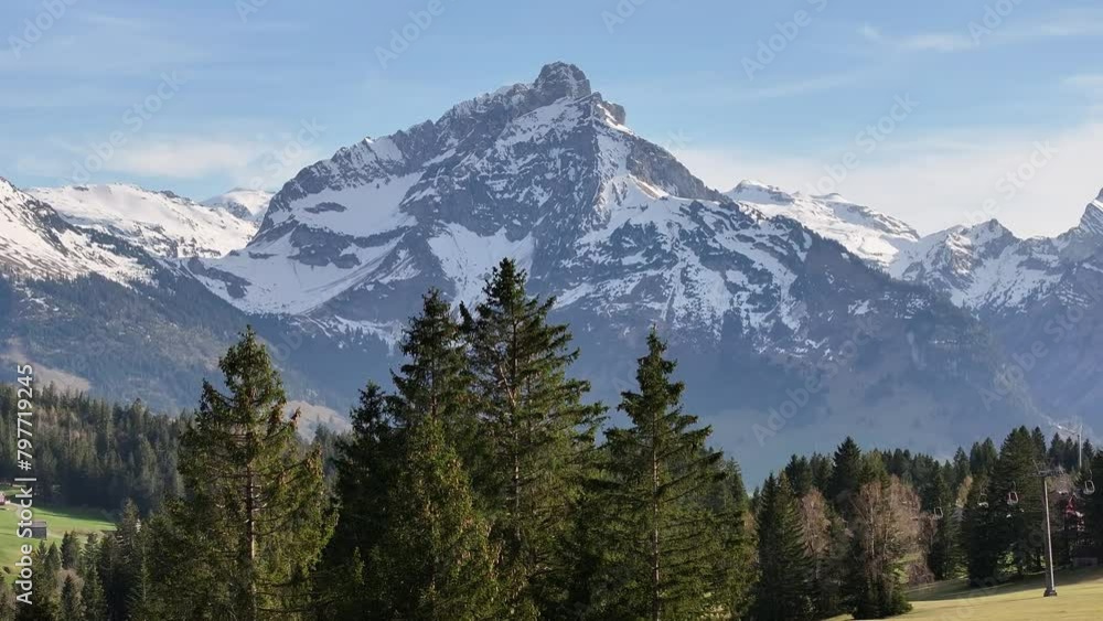 Alpine majesty: Amden Arvenbüel mountain peak in spring, Switzerland - aerial Alpine majesty: Amden Arvenbüel mountain peak in spring, Switzerland - aerial