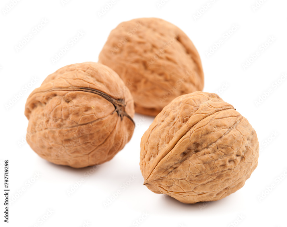 Three whole walnuts, detailed texture, white background isolated Three whole walnuts, detailed texture, white background isolated