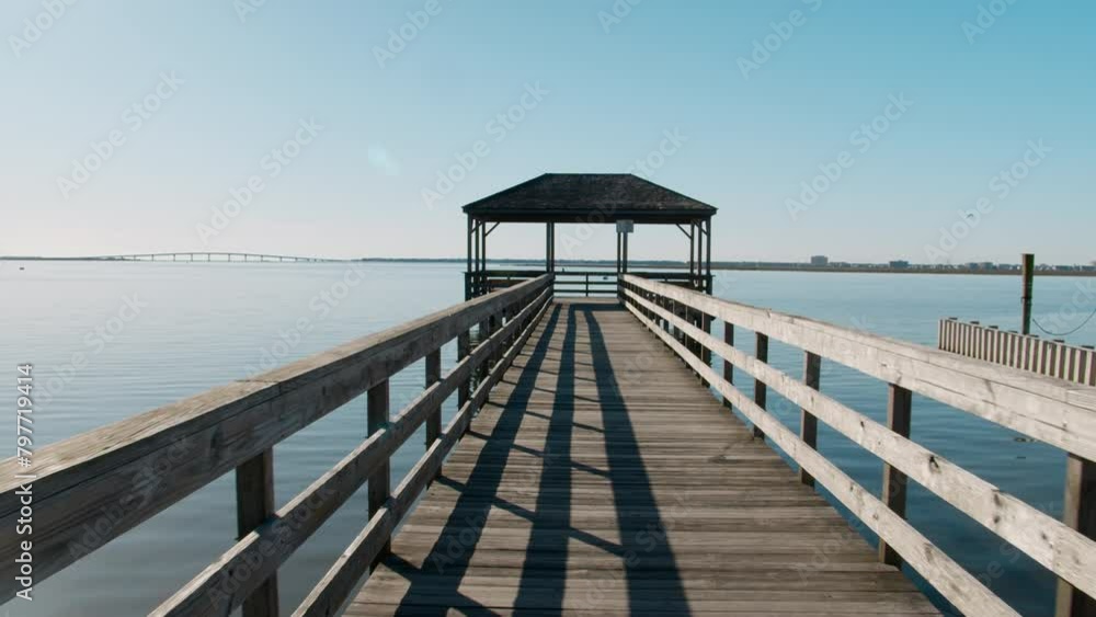 Walking to End of Pier over Glassy Clear Harbor Walking to End of Pier over Glassy Clear Harbor