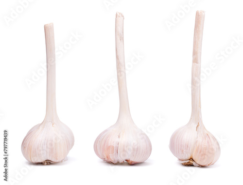 Three garlic bulbs, white background, isolated © Jacek Fulawka