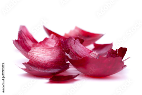 Vivid red onion skins, rich in texture and color, captured in high detail. Perfect for culinary or nutritional content. White background, isolated, natural shadow © Jacek Fulawka