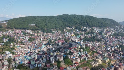 Aerial footage of the cityscape of Tansen on a sunny day in Palpa city in Lumbini in central Nepal photo