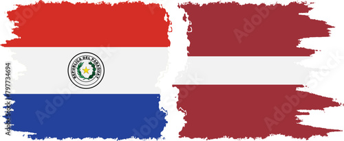 Latvia and Paraguay grunge flags connection vector photo