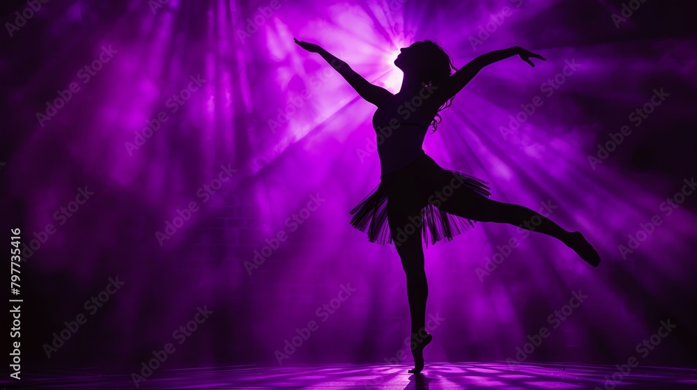 Dancer silhouette against deep purple spotlight